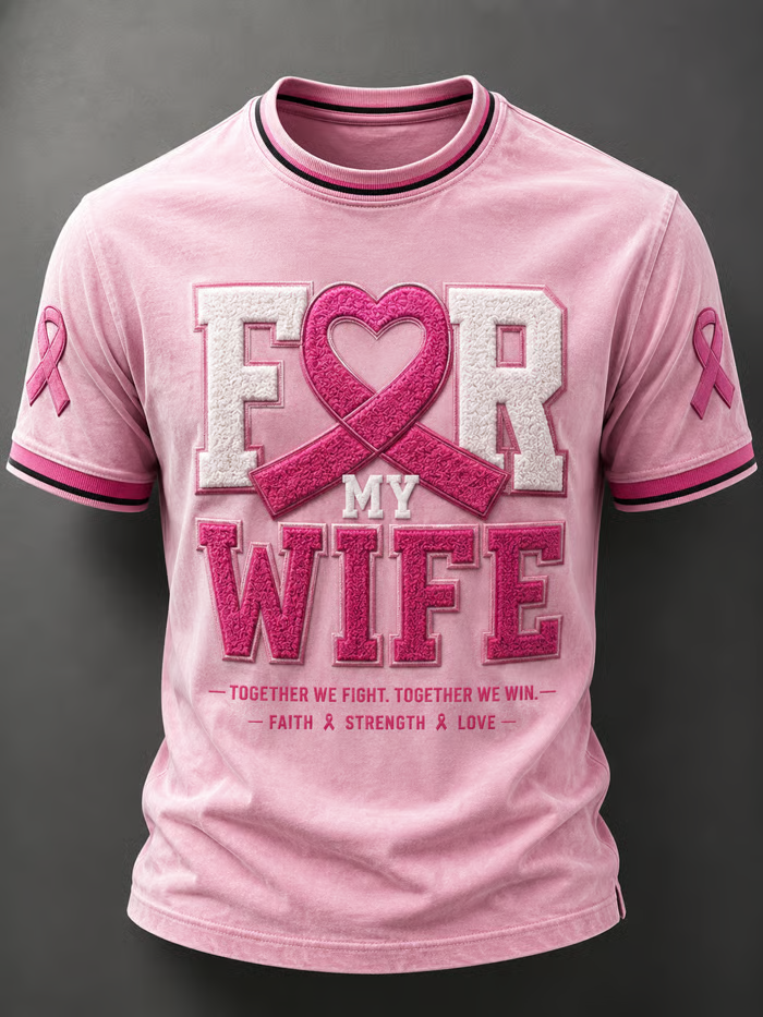 A man wore pink to support his loved one, wearing a printed crew neck top.